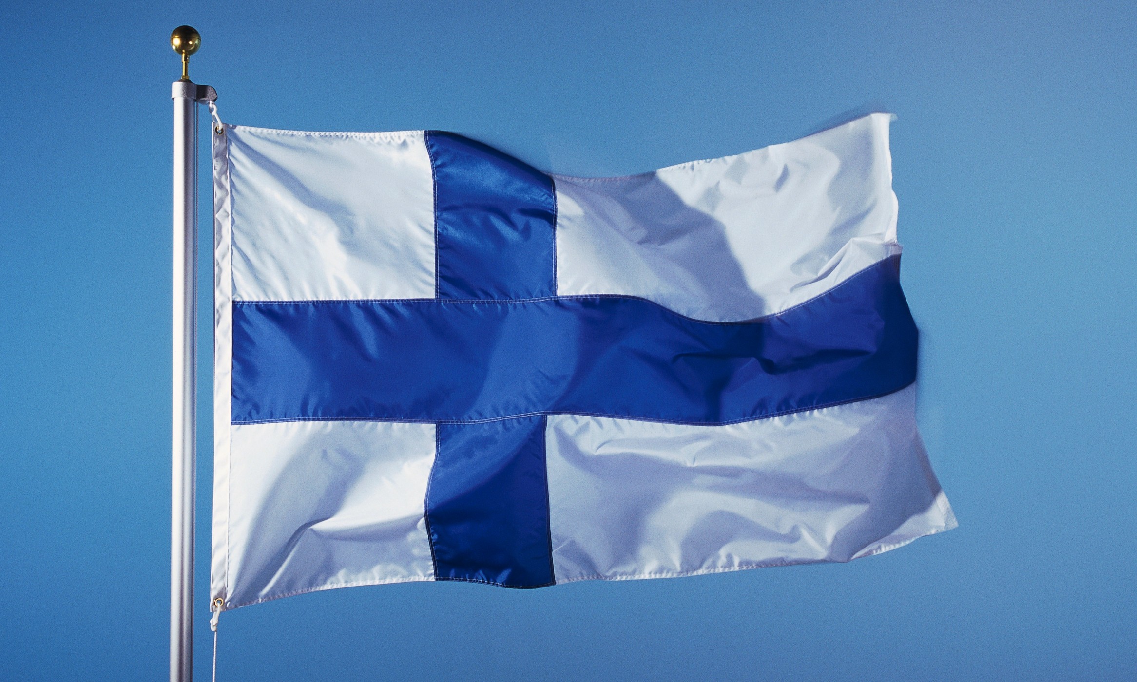 flag_finland_hoisted_blue_sky